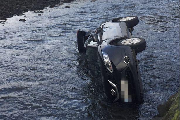 Car plunges into river